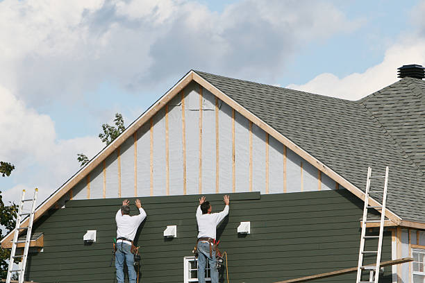Professional Siding technician working in Woburn, MA